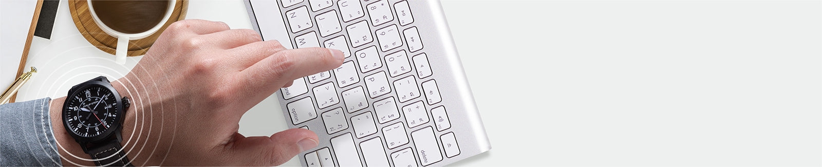 Man typing on a keyboard