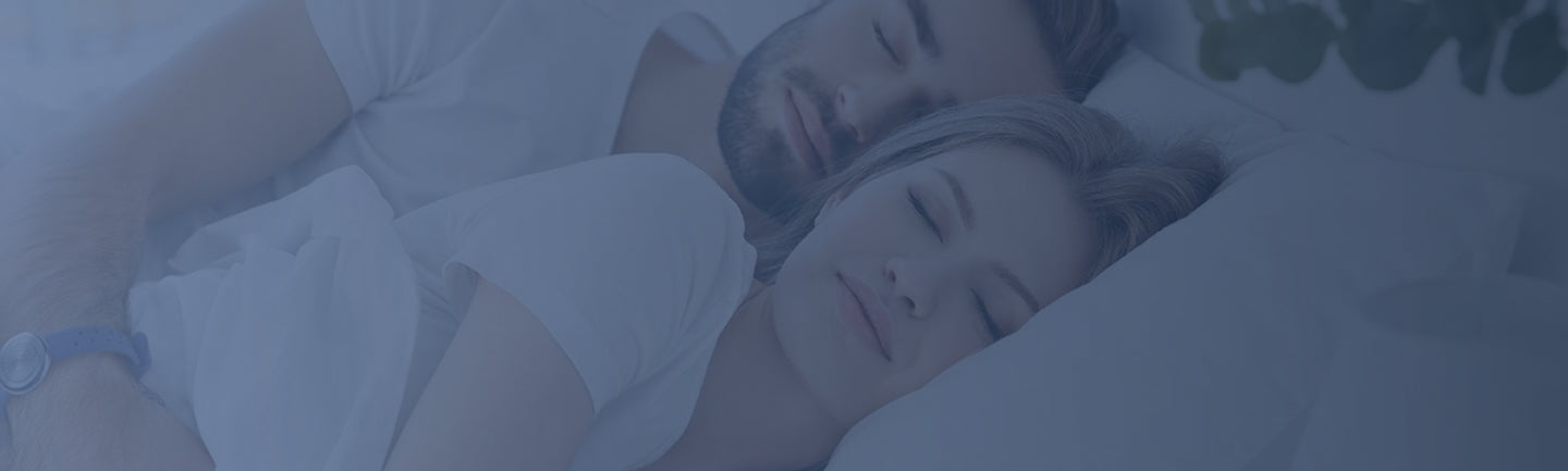 Couple sleeping in bed